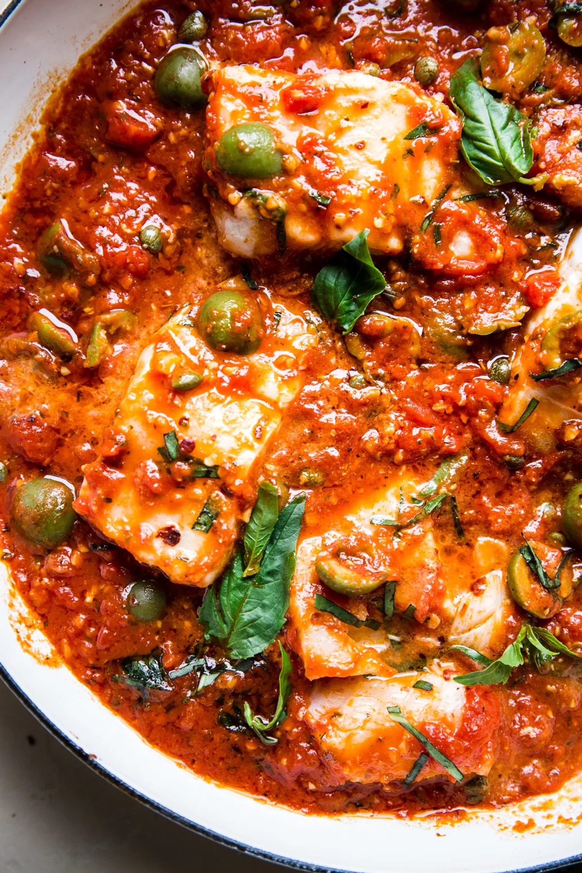 Swai Fish Puttanesca • 23g Protein • Tender swai roasted in a rustic tomato sauce with olives, capers, garlic & herbs.